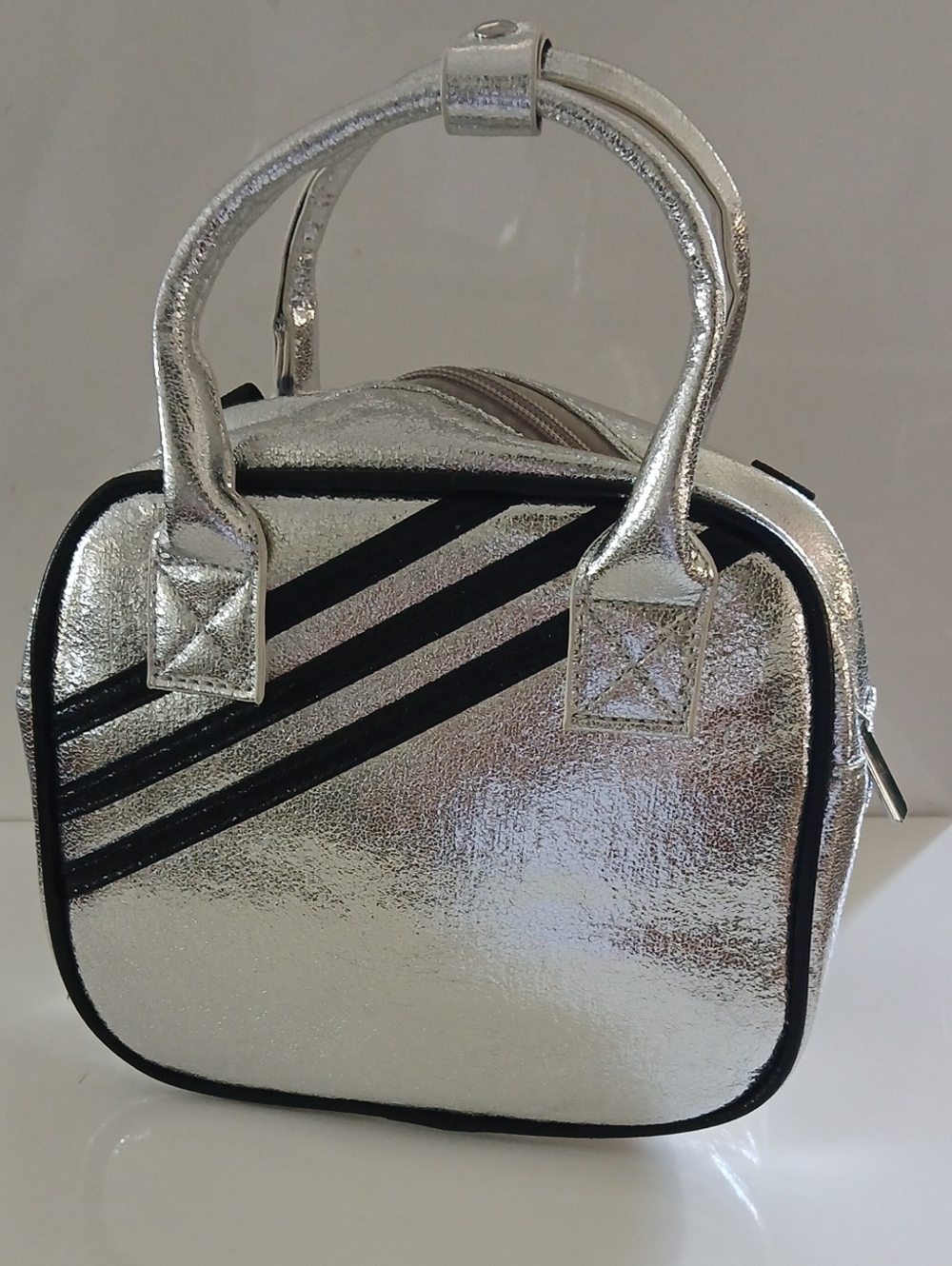 Silver Metallic Womenโs Handbag with Black Trim/ Shoulder Bag /Back Pack NWT